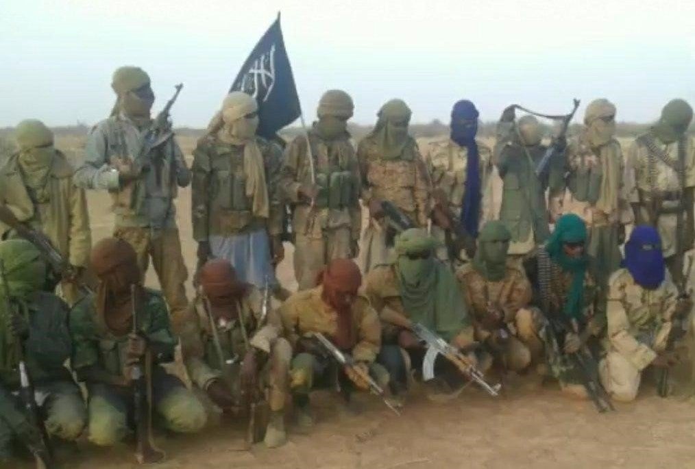 A group of armed men pose for a photo