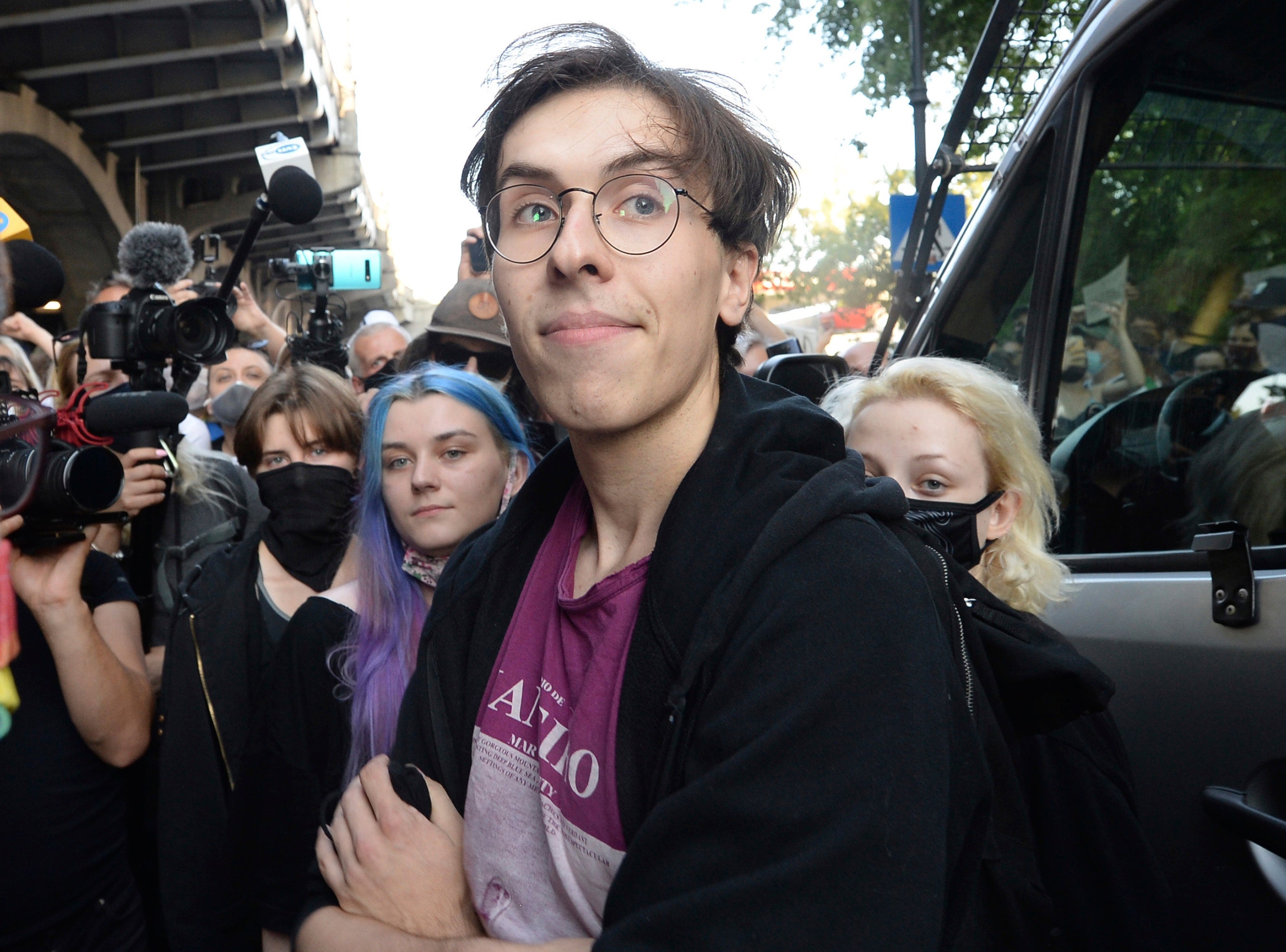 Activist Malgorzata Szutowicz, center, known as Margot, before being arrested in Warsaw, Poland,