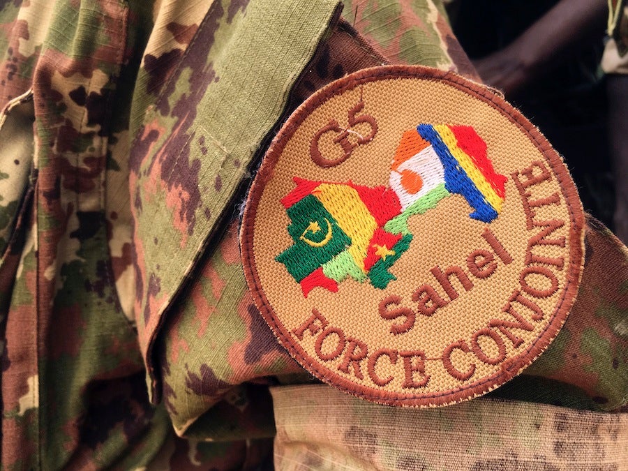 A soldier stands guard in front of the G5-Sahel Counter Terrorism Force headquarters in Mali, May, 30, 2018. 