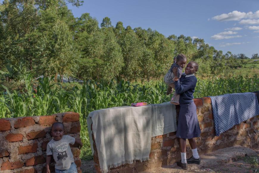 A 17-year-old girl from western Kenya who dropped out of lower secondary school when she got pregnant. She received no information that would have allowed her to continue going to school while she was pregnant, but she wants to continue studying so she can find a job and care for her child.