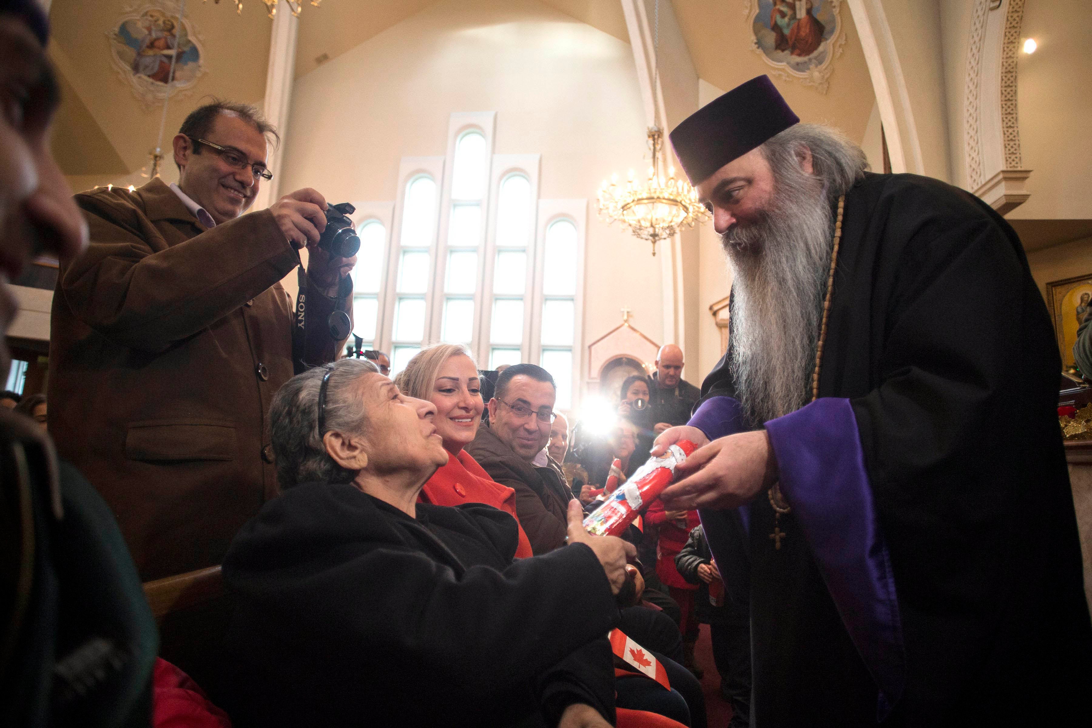 202202americas_canada_priest