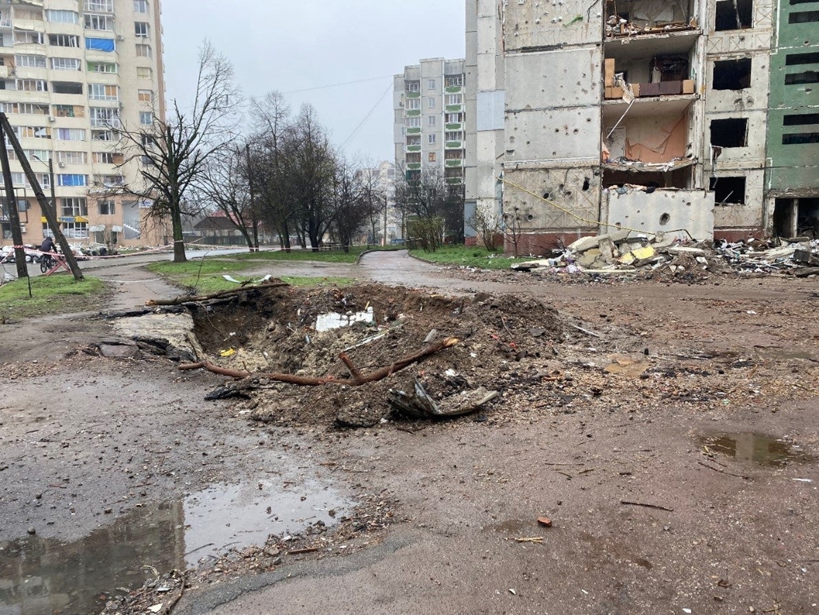 Impact crater and damage to residential buildings