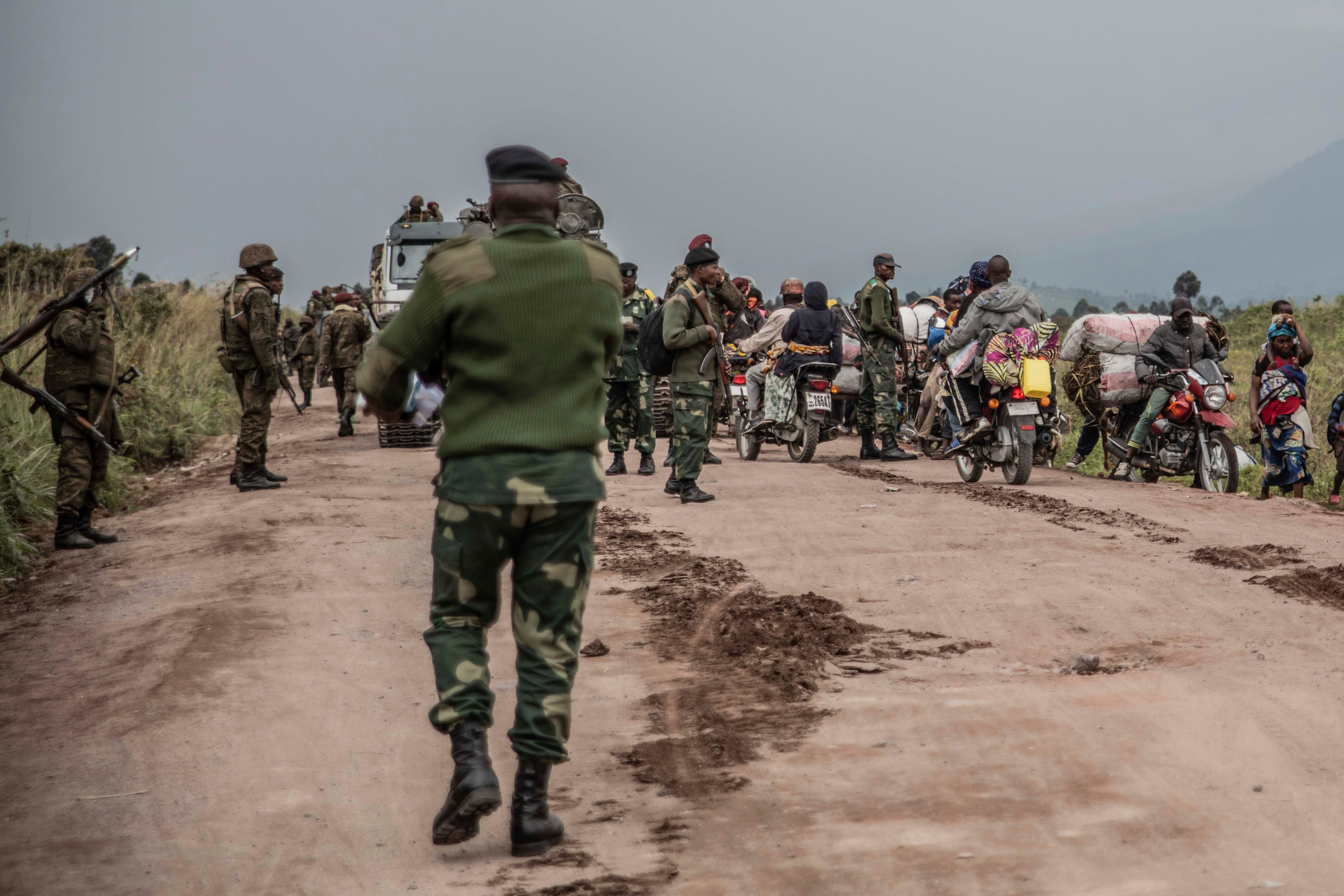 People fleeing fighting between Congolese forces and M23 rebels near Kibumba in North Kivu, Democratic Republic of Congo, May 24, 2022.