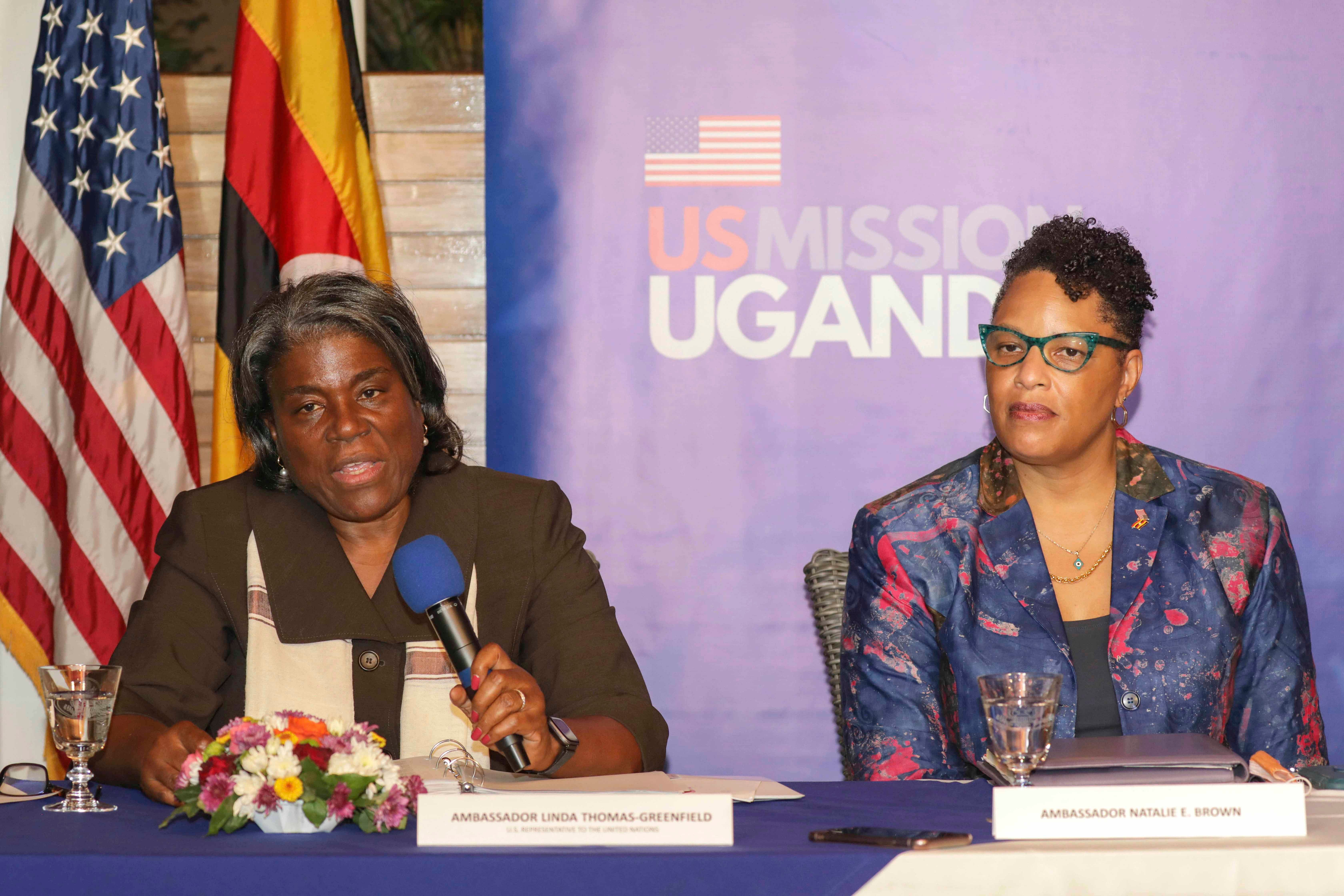 Two women speaking at a press conference