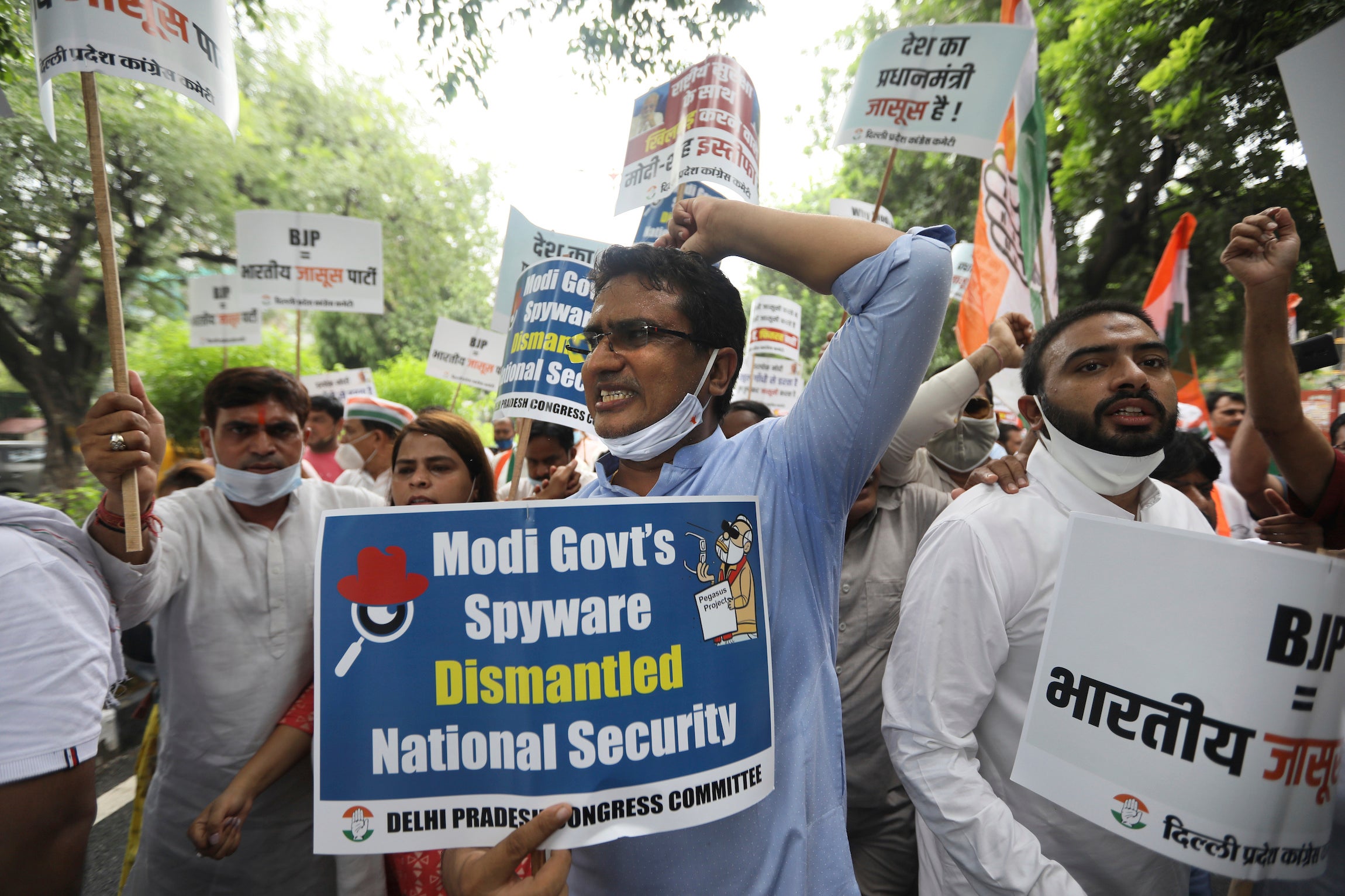 Congress party workers shout slogans during a protest accusing Prime Minister Narendra Modi's government of using military-grade spyware to monitor political opponents, journalists and activists in New Delhi, India.