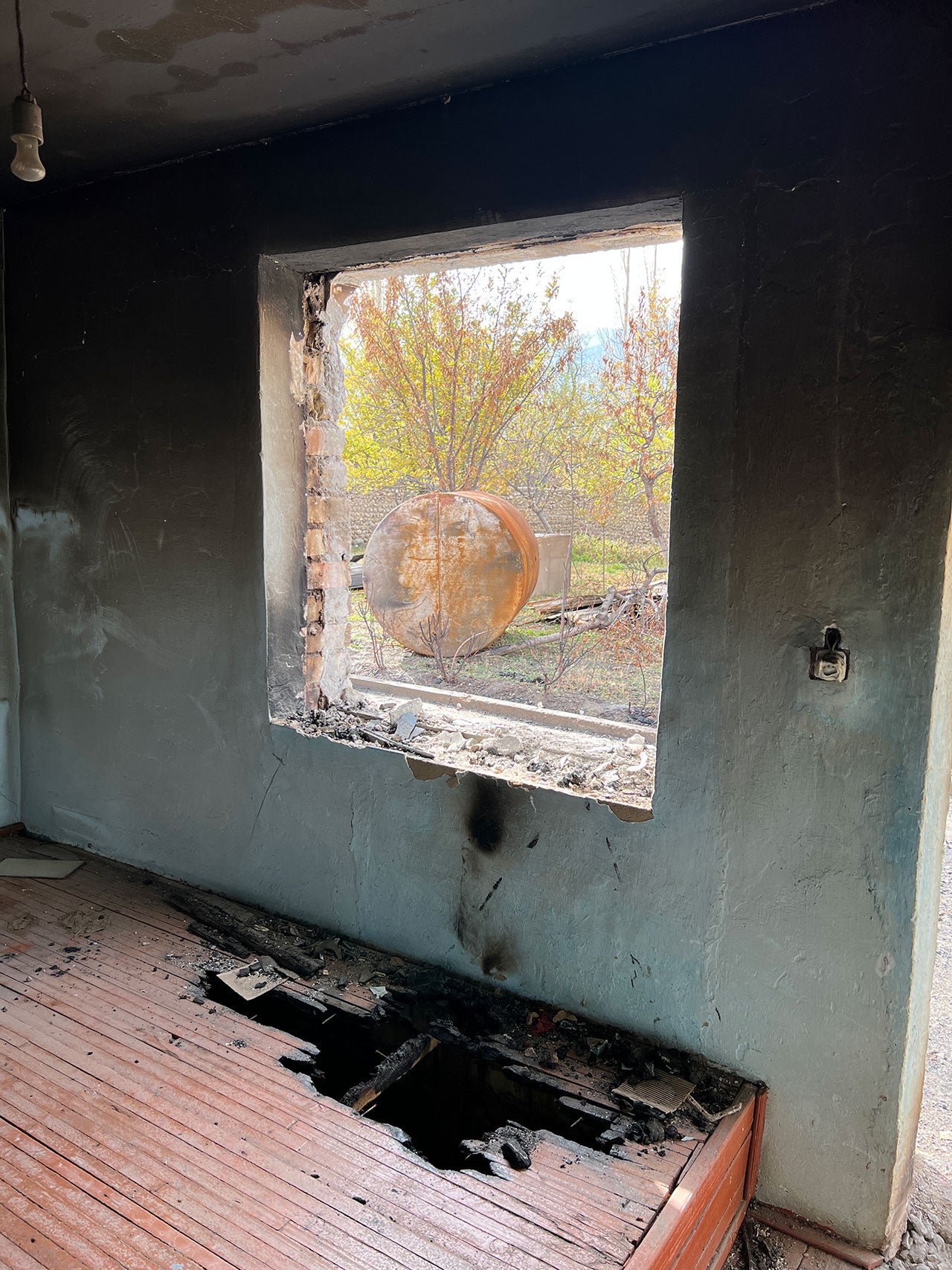 Burn marks from a fire that apparently failed to spread in a house in the Kyrgyz village of Ak-Sai.
