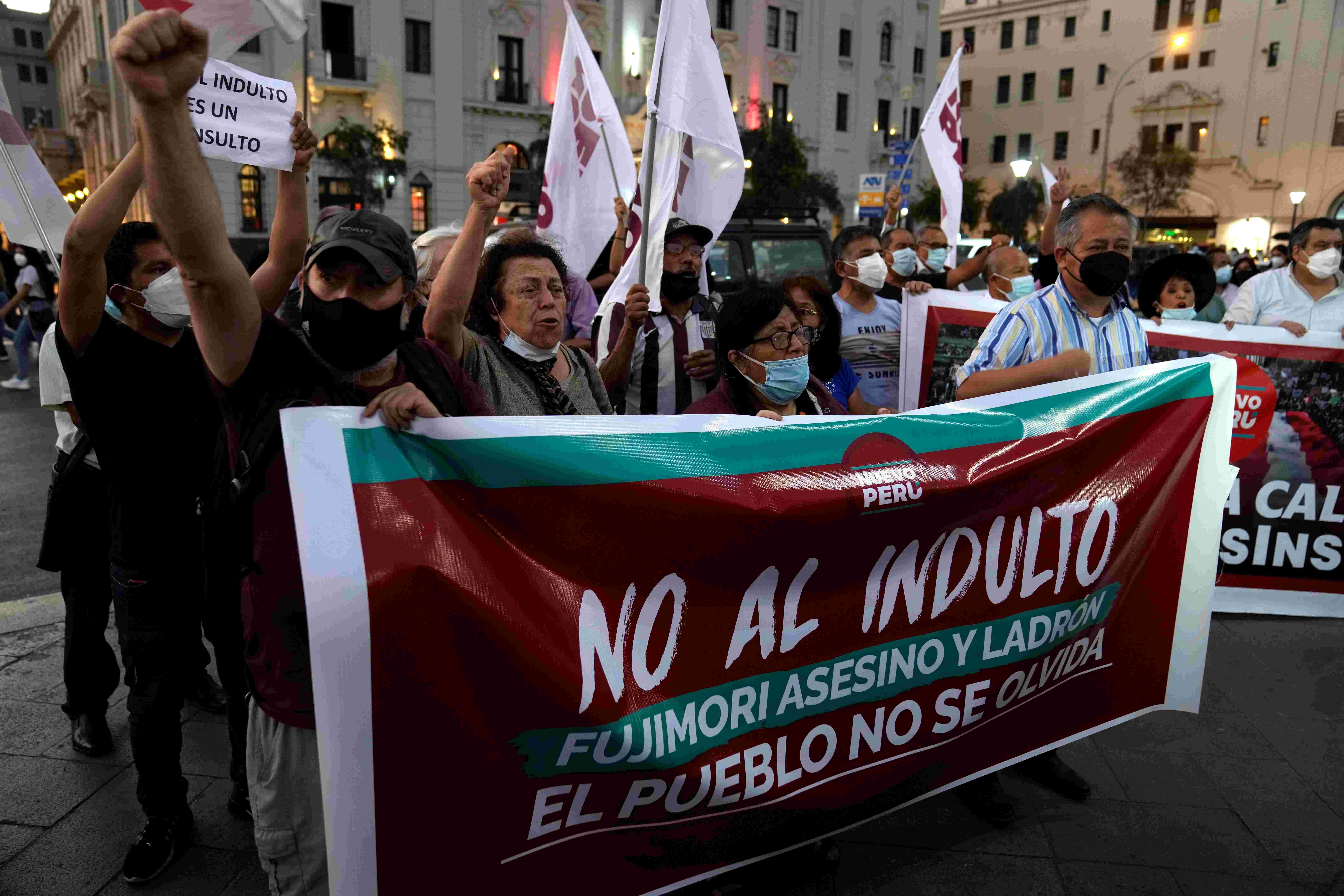 Protesters holding up a banner