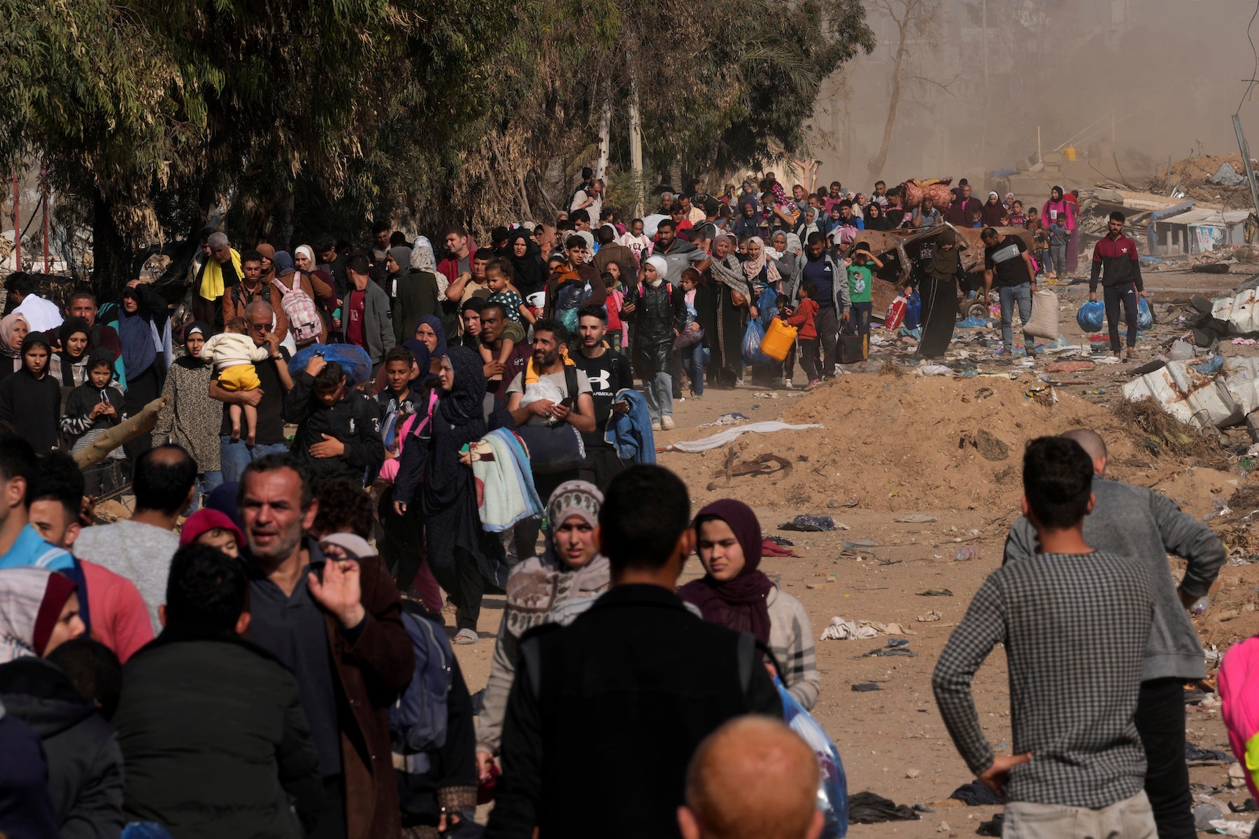 People flee to the southern Gaza Strip along Salah al-Din Street, November 18, 2023.