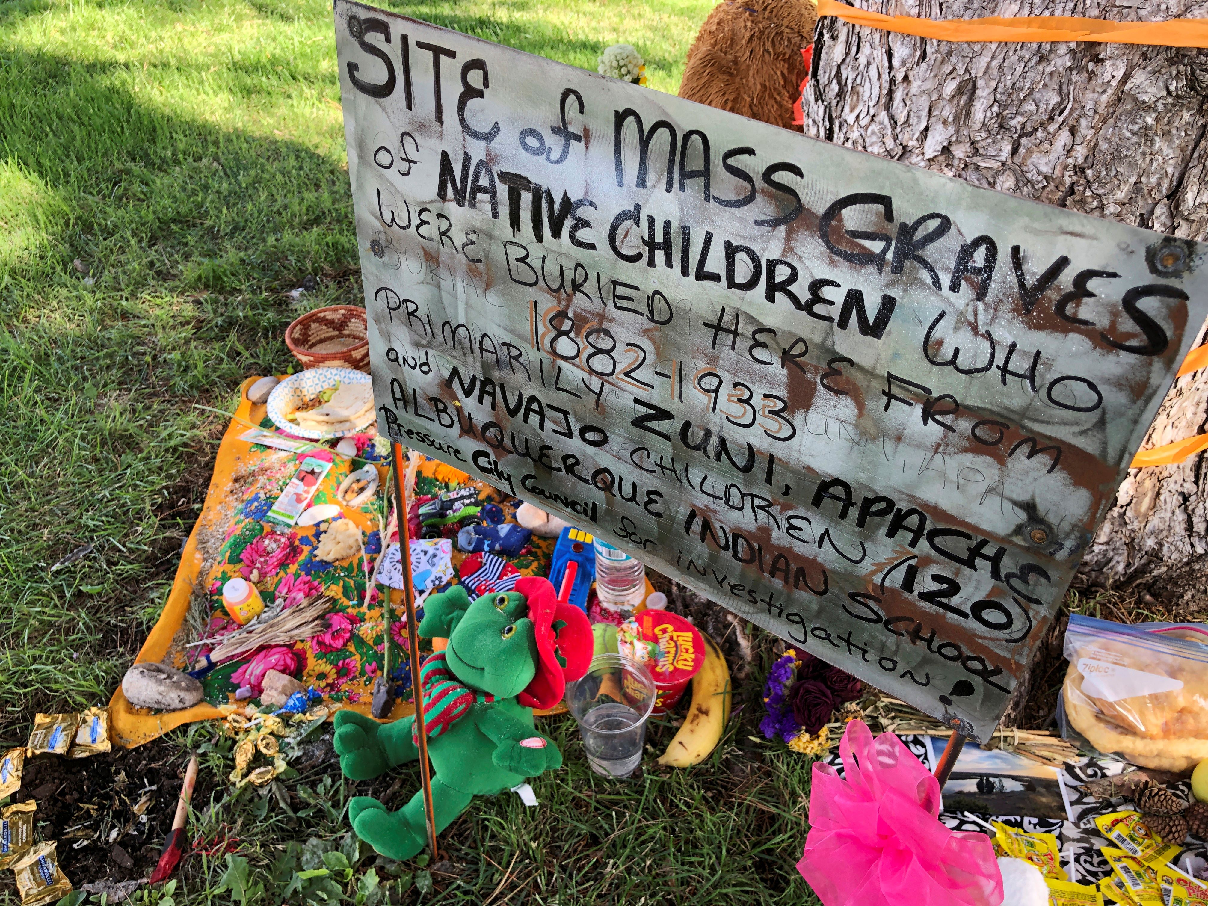 A makeshift memorial under a tree