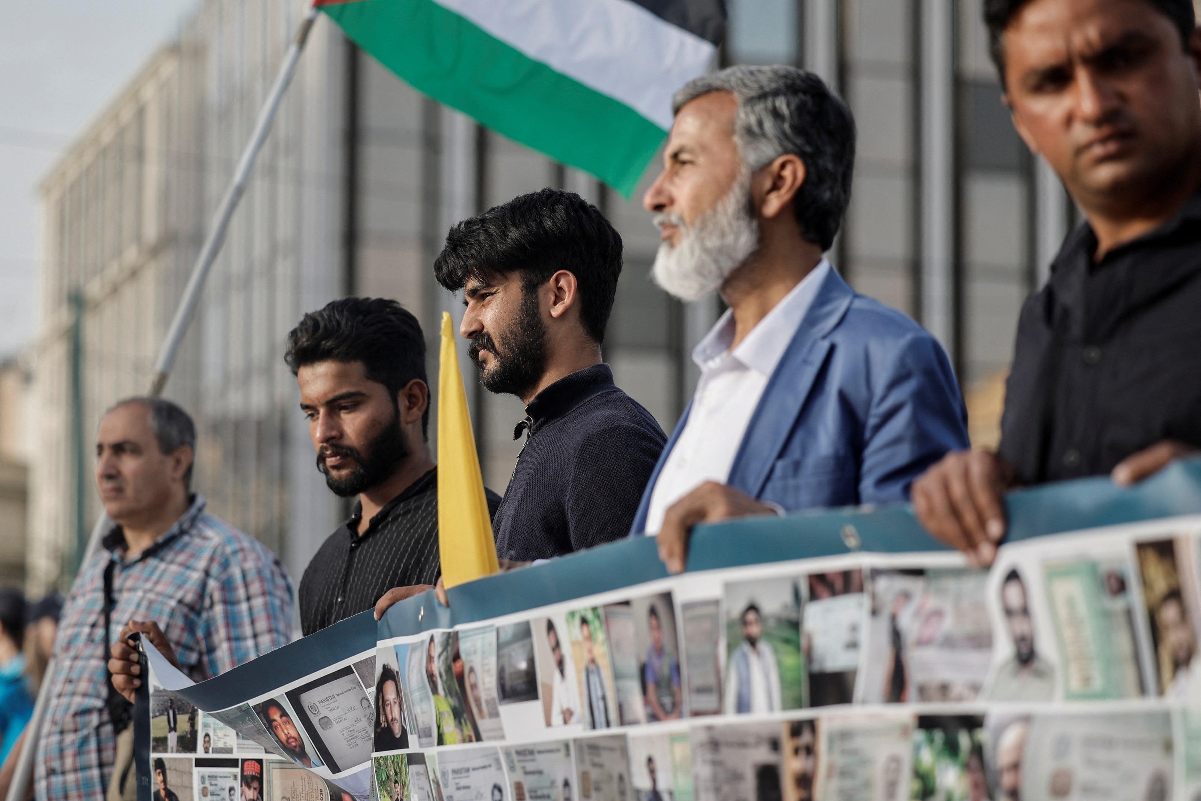 Two survivors of the deadly Pylos shipwreck along with supporters participate in a protest calling for justice in Athens, Greece, May 20, 2024.
