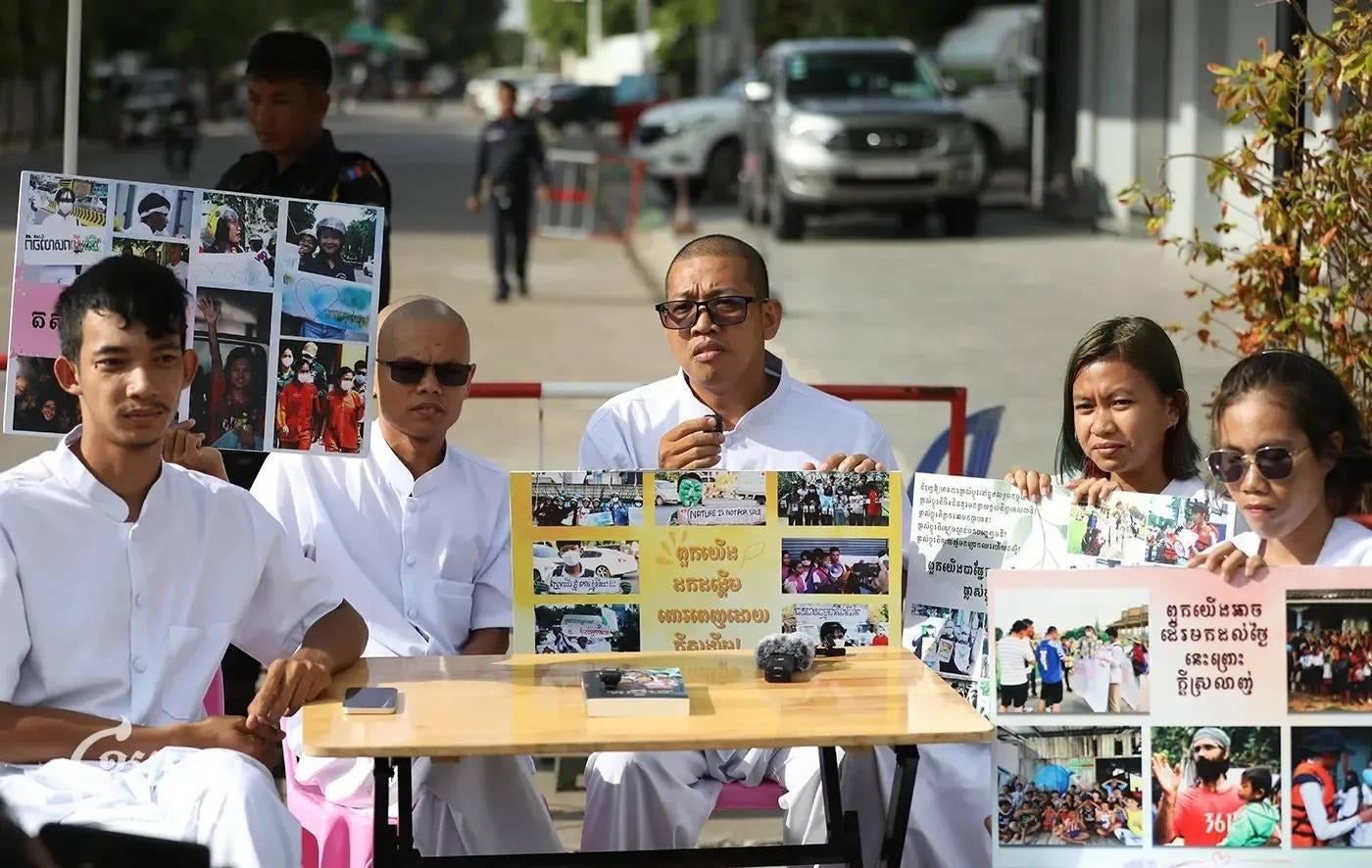 Five Cambodian activists record a podcast.