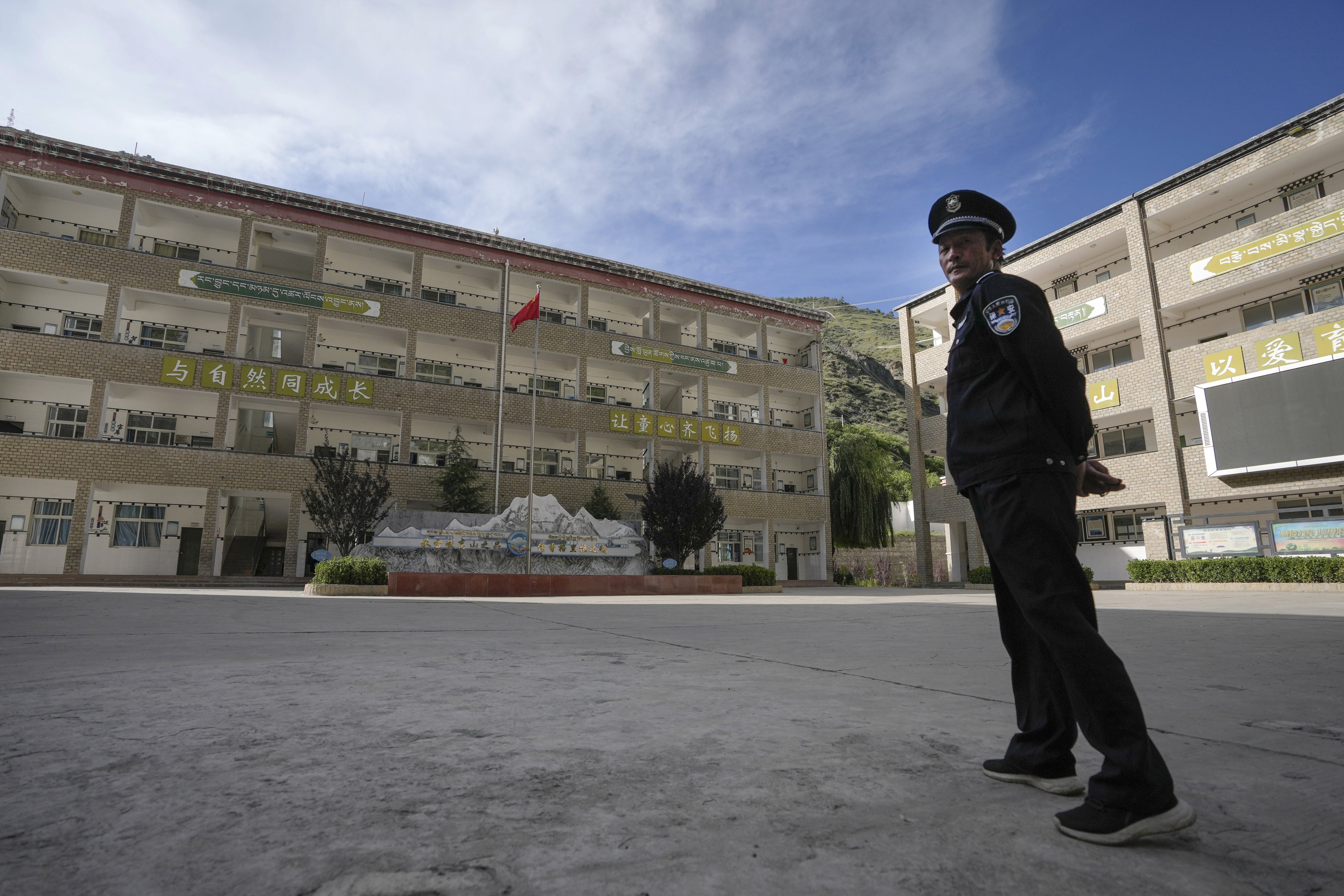 A security guard outside the Shangri-La Key School in Kardze Tibetan Autonomous Prefecture, Sichuan province, China, September 5, 2023. 