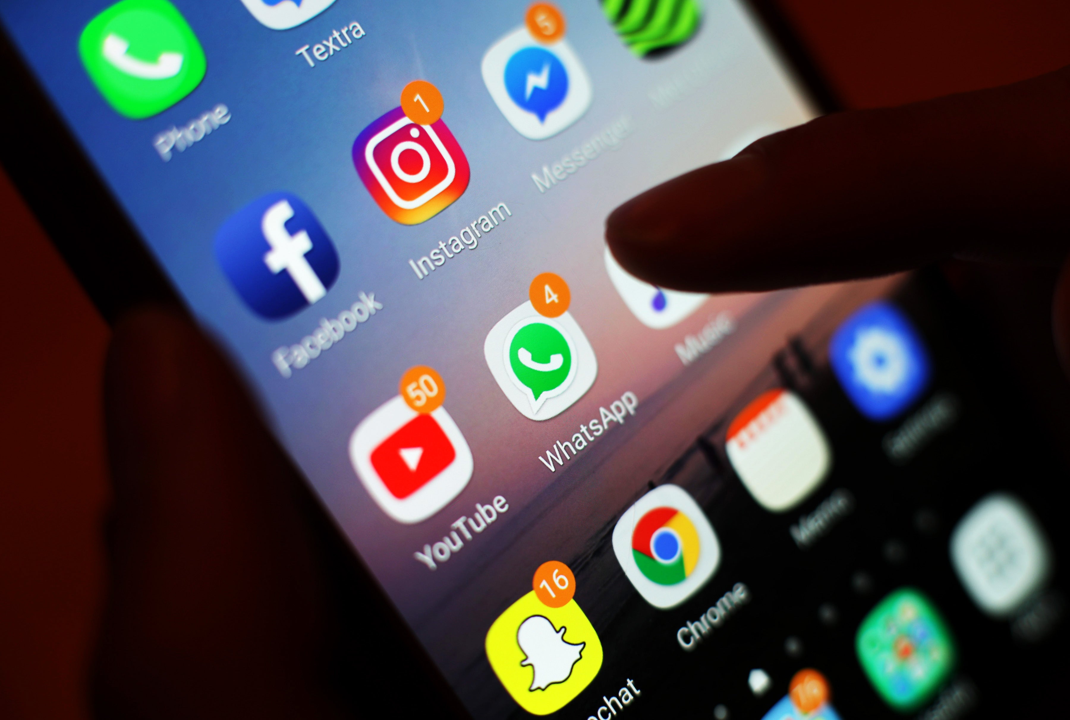 Social media apps on a mobile phone.