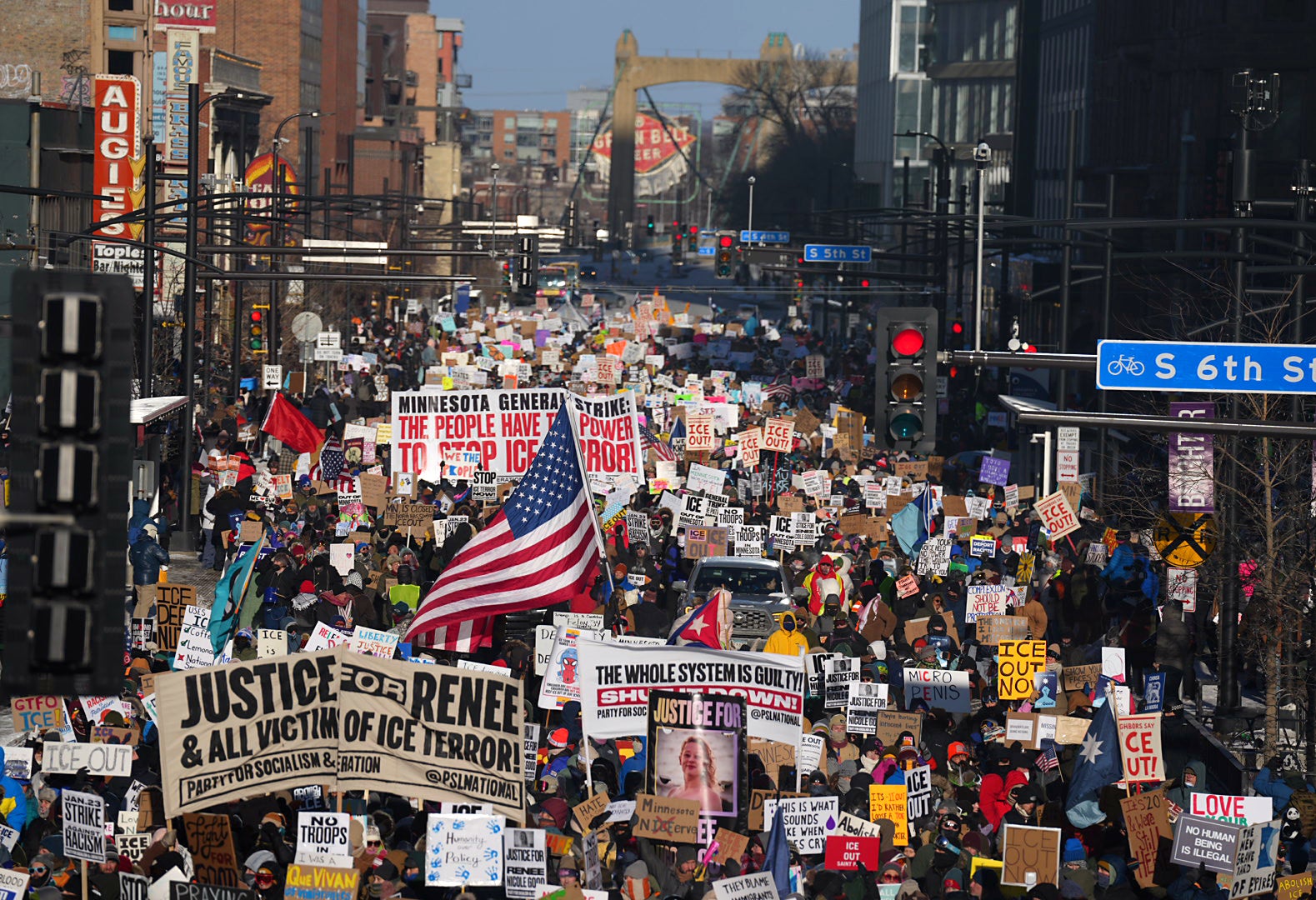 marchers in downtown Minneapolis, Minnesota, on Friday, January 23, 2026, waved signs decrying ongoing immigration enforcement operations
