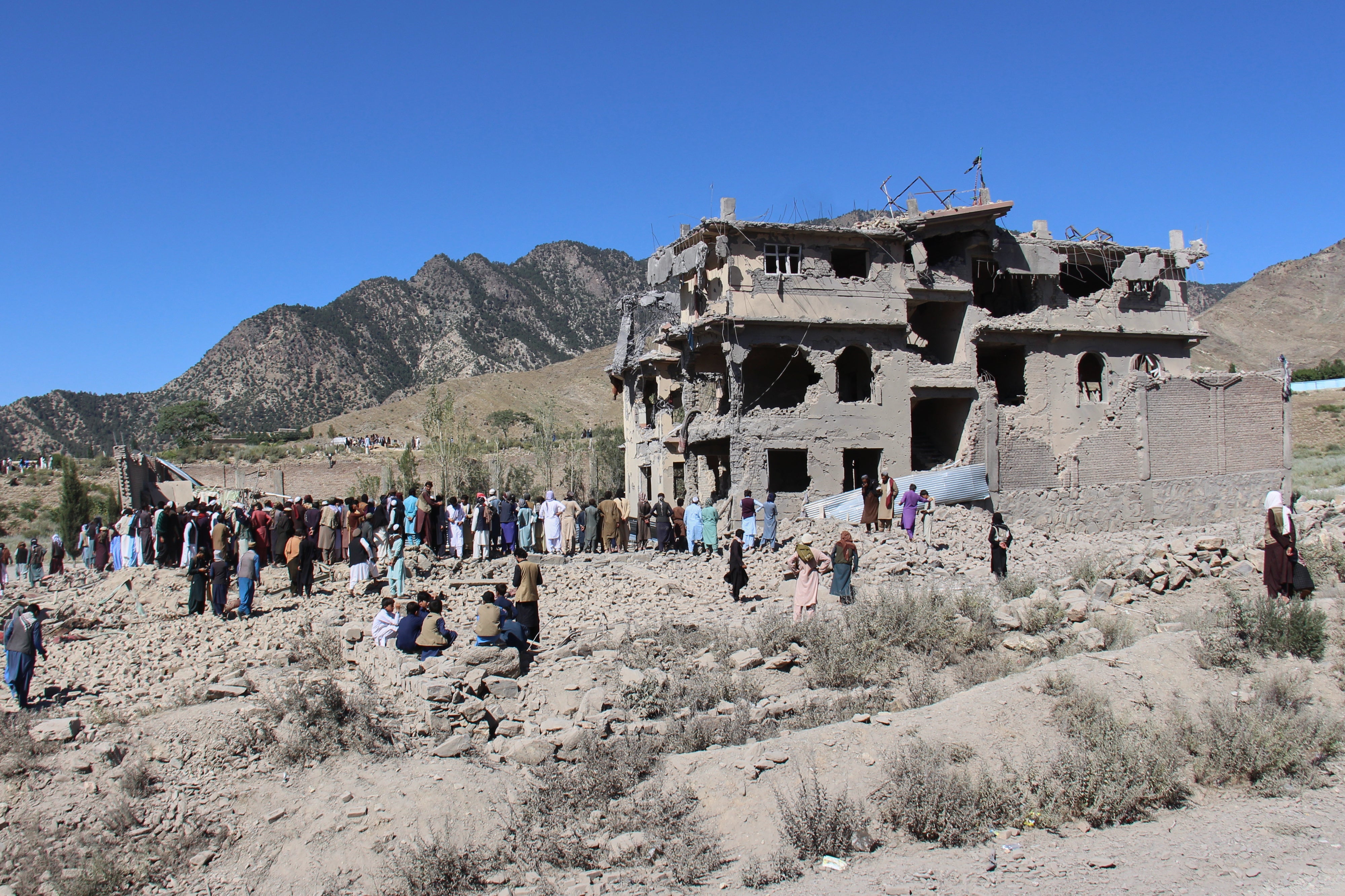 Residents walk through the rubble from Pakistani airstrikes that killed civilians in the village of Mandokhail, Chamkani district, Afghanistan, June 29, 2026.