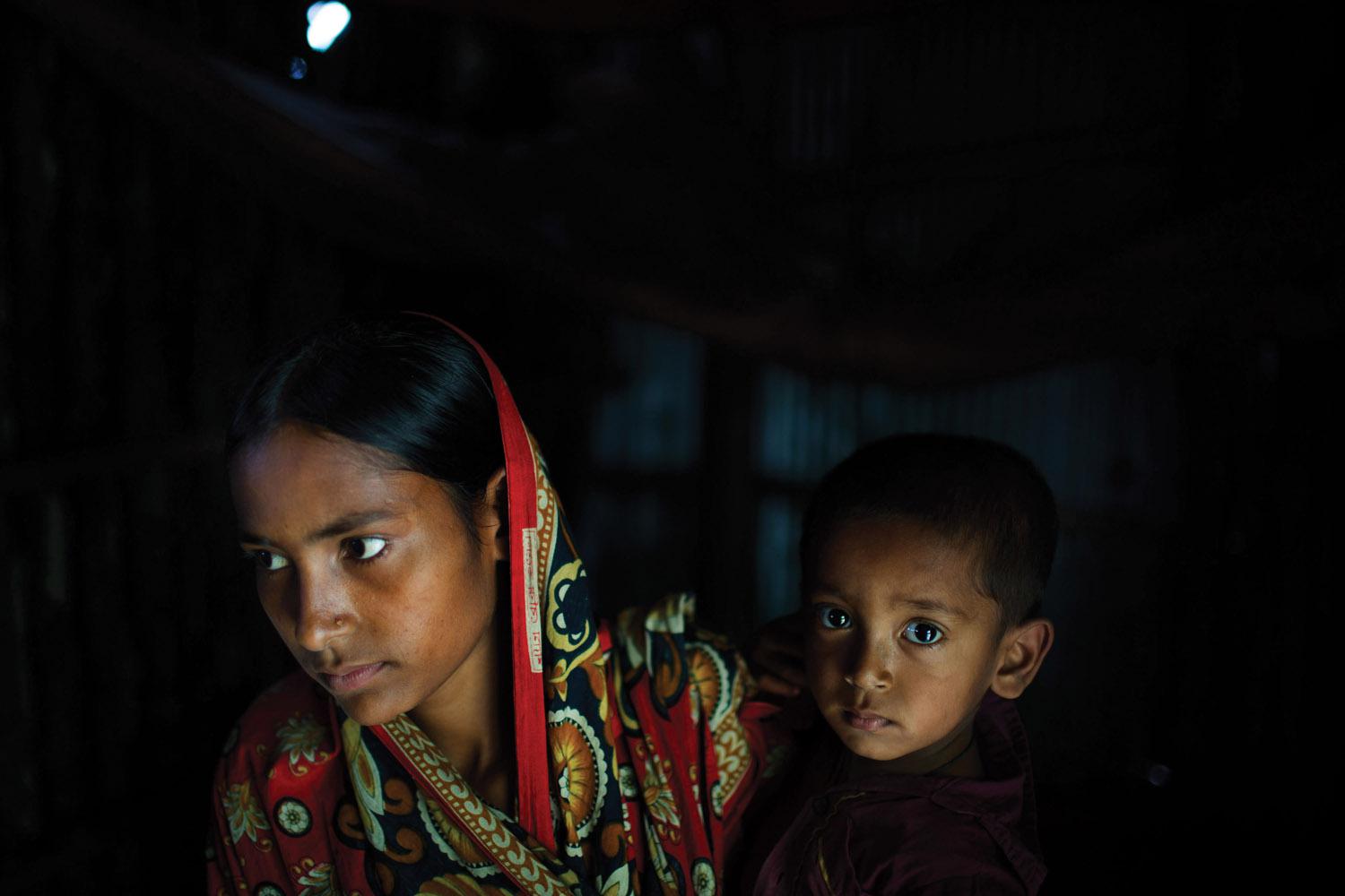 Belkis, 15 years old, holds her one-year-old son in the house where she lives with her mother, two sisters, and one brother. Belkis was married when she was 13 years old to a man who threatened to commit suicide if the family didn’t agree to the marriage.