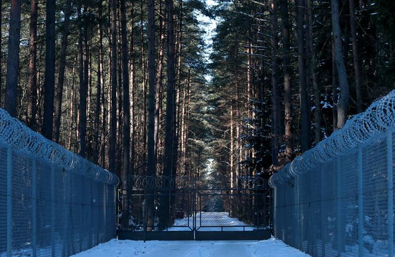 Barbed wire fence surrounding a military area