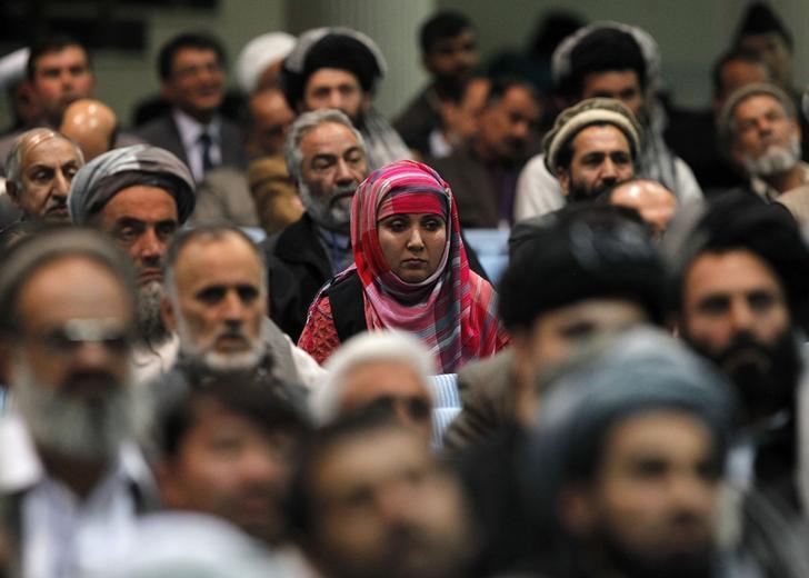 Members of the Loya Jirga, grand council, attend during the last day of the Loya Jirga, in Kabul on November 24, 2013.