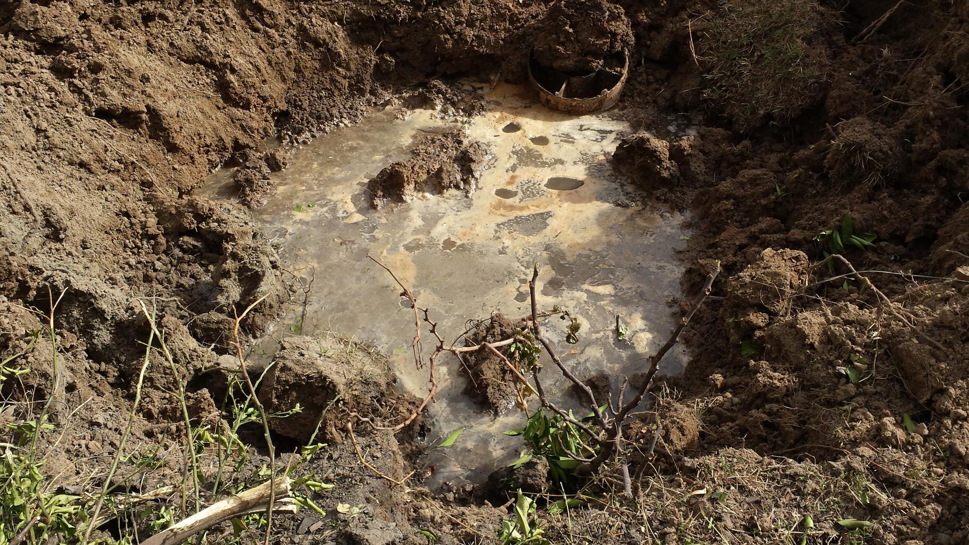 Remnant of a weapon that struck the town of Qayyarah on September 21, 2016 and photographed that day. The chemical agent inside has been diluted with water by local residents.