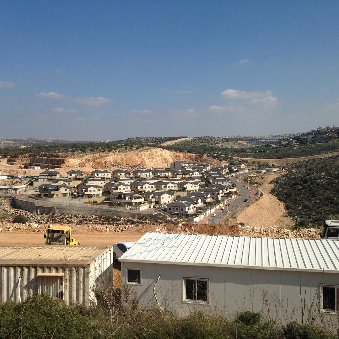 Bulldozers clear land for construction of the Ahdut Elkana project in the Israeli settlement of Elkana.