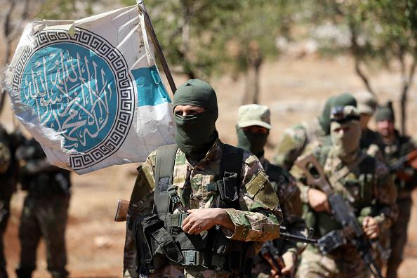 New fighters of the al-Qaeda-linked Hayat Tahrir al-Sham attend a mock battle in anticipation of an attack by Syrian government forces on northern Idlib province and the surrounding countryside, August 14, 2018.