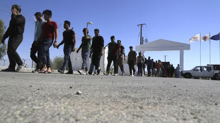 Migrants from Syria walk towards a refugee camp at Kokkinotrimithia, outside of the capital Nicosia, in the eastern Mediterranean island of Cyprus, September 10, 2017. 