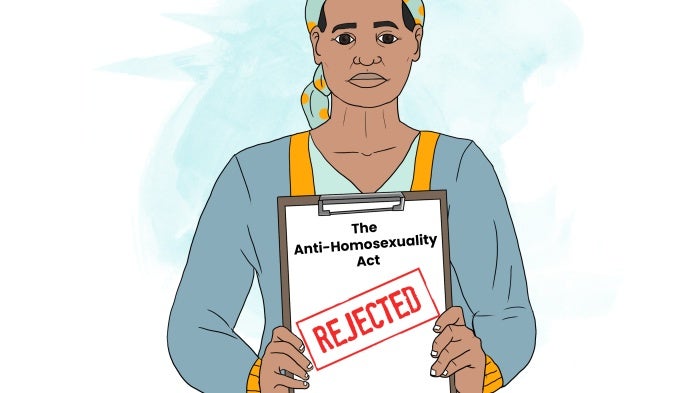 A woman holds up a document with a "rejected" stamp on it