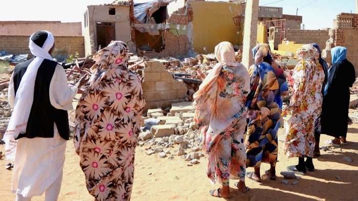 People pray for the victims of a drone strike in El Obeid, North Kordofan State, Sudan, January 12, 2026.