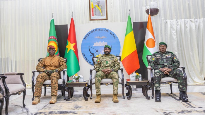 Capt. Ibrahim Traoré of Burkina Faso (left), Gen. Assimi Goita of Mali (center), and Gen. Abdourahamane Tchiani of Niger attend the second summit on security and development in Bamako, Mali, December 23, 2025. 