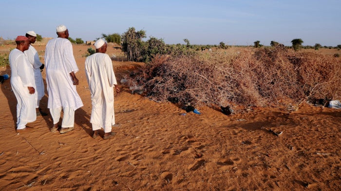 Villagers from Al-Luwaib in North Kordofan stand at a burial site for victims of a drone strike, in El Obeid, Sudan, January 14, 2026.