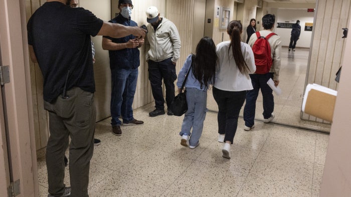 Plainclothes Immigration and Customs Enforcement (ICE) officers detain an immigrant leaving their scheduled court appearance at a Federal immigration court in New York City, June 4, 2025.