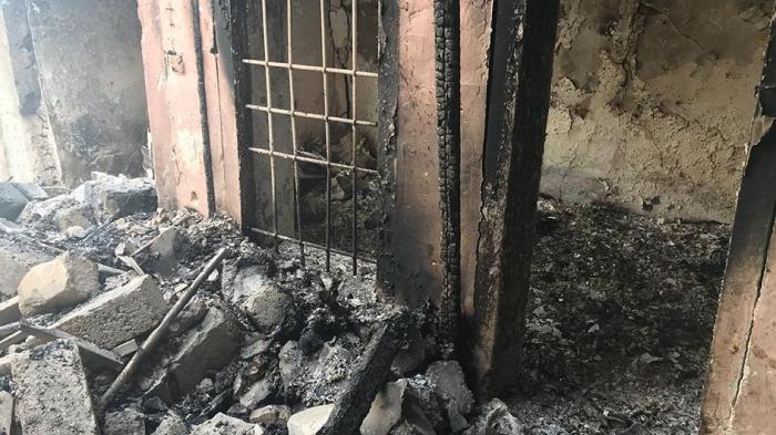 Burned out remains of a room in a damaged house in Mosul’s Old City, following the authorities’ removal of about 80 bodies, April 4, 2018.  © 2018 Belkis Wille/Human Rights Watch