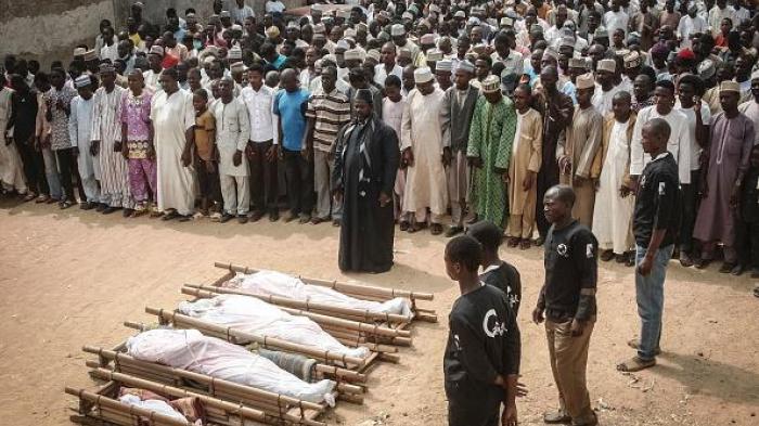 Sanusi Abdulkadir, a leader of the Islamic Movement in Nigeria (IMN) leads on November 16, 2016 in Kano the funeral prayers for the some of the victims of clashes that broke out on November 14 between police and members of the Islamic Movement in Nigeria 