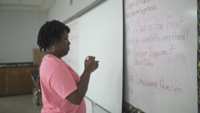 Woman at white board