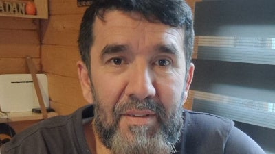man smiling in a photo