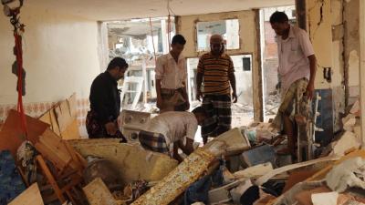 Men dig through rubble in a residential compound housing employees of the Mokha Steam Power Plant and their families following an airstrike by the Saudi-led coalition that killed at least 57 civilians in Mokha on July 24, 2015. Photograph by Ole Solvang.