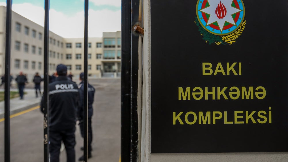 Police officers stand outside a courthouse on January 21, 2025, in Baku, Azerbaijan. 