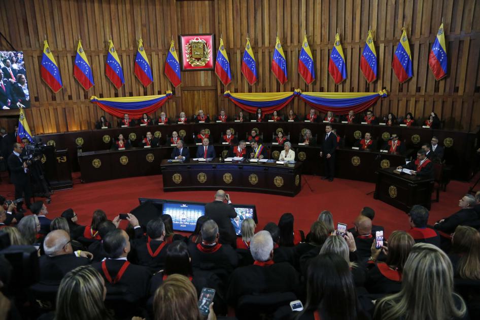 Nicolas Maduro, sitting at desk second from right, speaks with Supreme Court President Maikel Moreno at the Supreme Court before giving his annual presidential address in Caracas, Venezuela. January 31, 2020. 