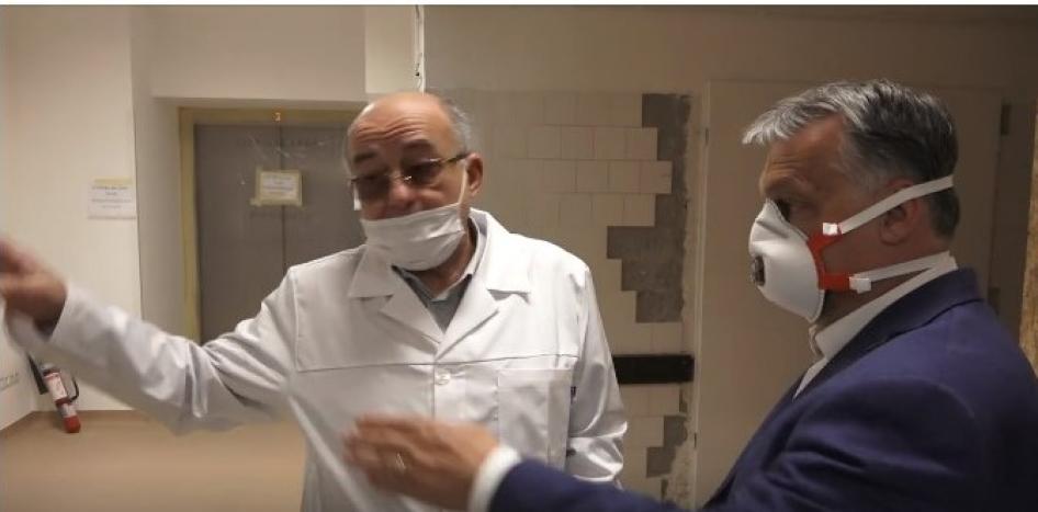 Prime Minister Orban in early April visiting the Budapest Korányi Institute of Pulmonology  - a clinic with specific responsibility for Covid-19 patients. In the background are some indications of disrepair including tiles falling off the wall and an “out of order” sign on the elevator.