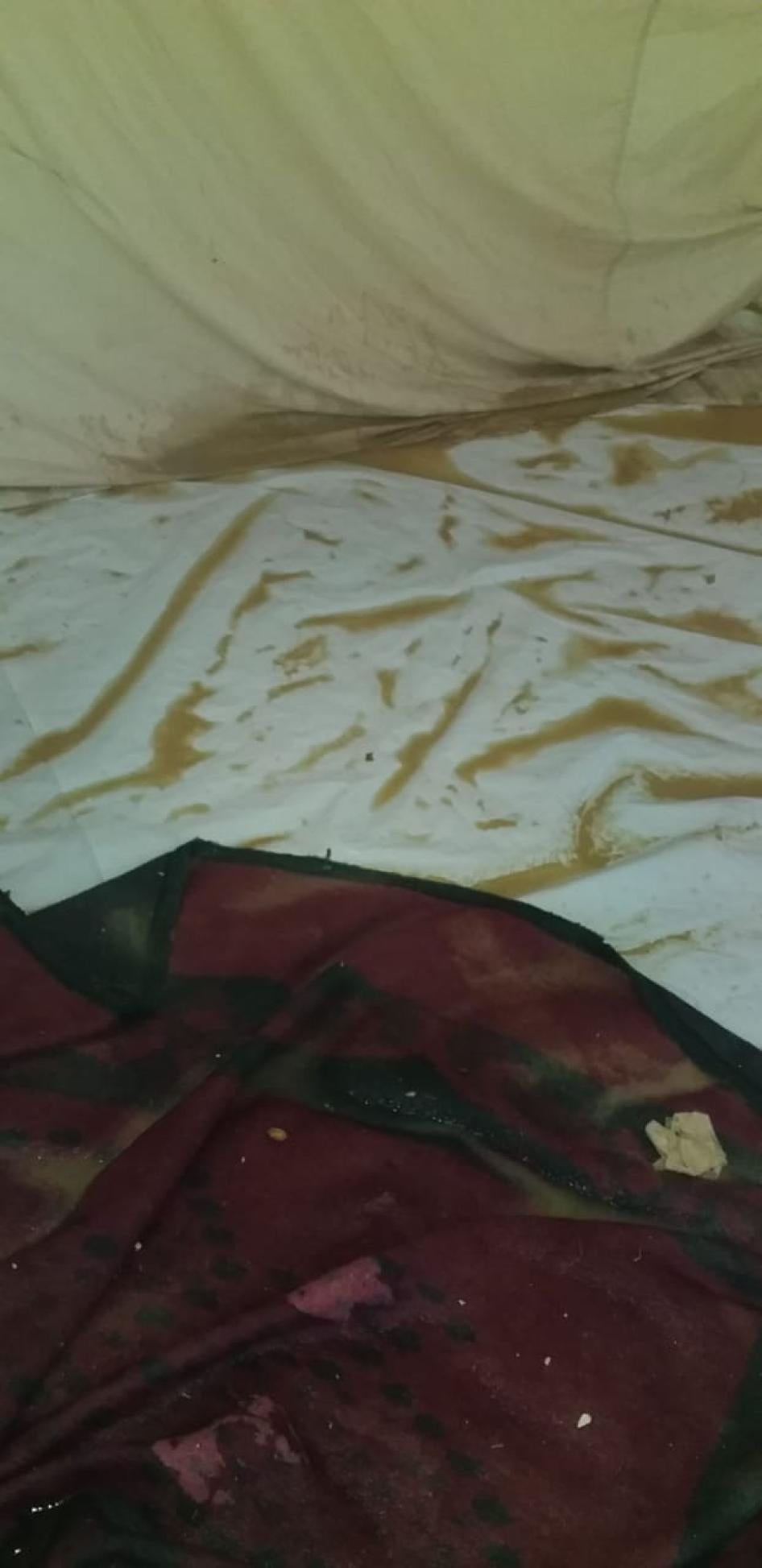Mud and water in a family’s tent after it rained in Mavrovouni. 
