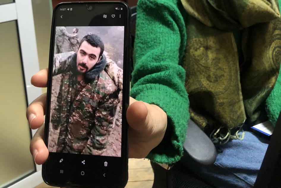 Liana Harutyunyan shows Human Rights Watch an image of her nephew Eric Khachaturyan, a prisoner of war (POW) in Azerbaijan, taken from a video in which he and other POWs are abused. Yerevan, November 2020.
