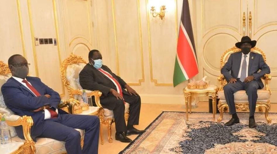 Former National Security Service official Akol Koor Kuc [left] is pictured with President Salva Kiir (R)