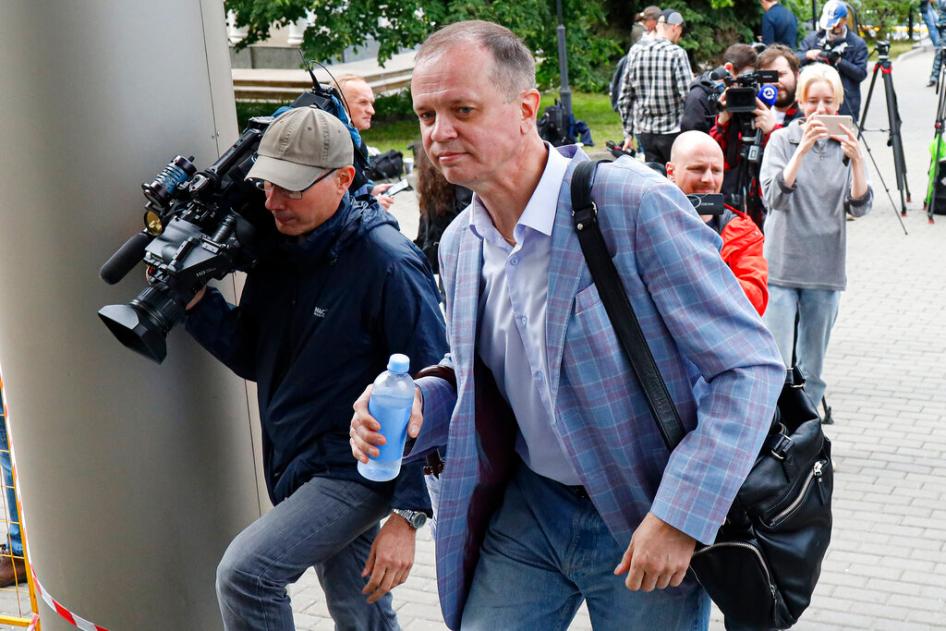 Russian lawyer Ivan Pavlov, center, walks to attend a court session after speaking to the media at Moscow Court, in Moscow, Russia, Wednesday, June 9, 2021. 