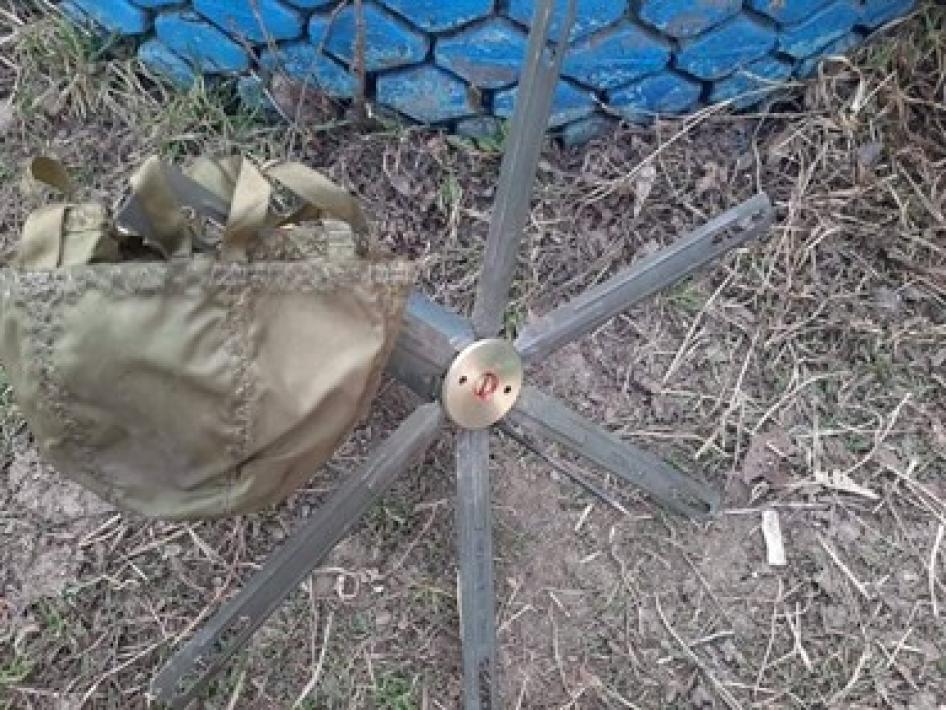 A POM-3 antipersonnel mine and its parachute that failed to deploy correctly and was found by deminers in the Kharkiv region, Ukraine, March 2022. 