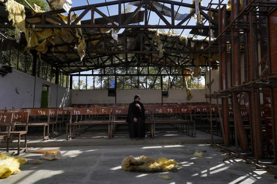A woman at the site of a suicide attack on an education center claimed by a group affiliated with the Islamic State, in Kabul, Afghanistan.
