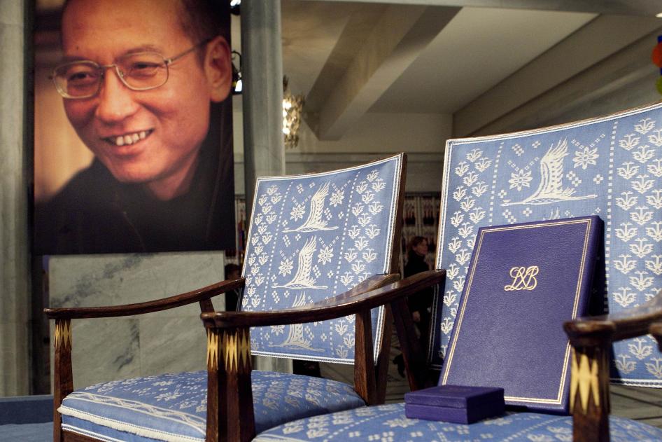 A diploma and medal placed on an empty chair