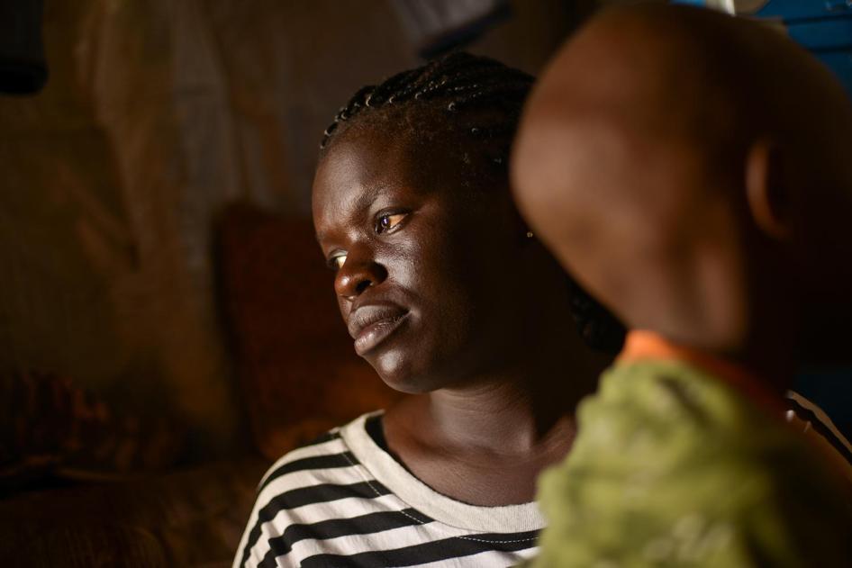 Fatma W. with her 7-year-old son born from rape.