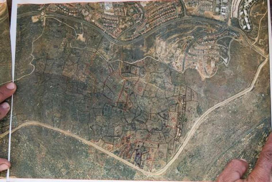 A farmer in the Palestinian town of Salfit, Nitham Shtayye, mapped the plots of land that the Israeli military confiscated or to which it restricts access around the settlement of Ariel. © 2015 Yoray Liberman