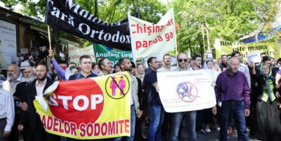 ©2016 Maxim Andreev for GENDERDOC-M. Demonstrators protest in opposition to an LGBT pride march held in Moldova in May 2016.