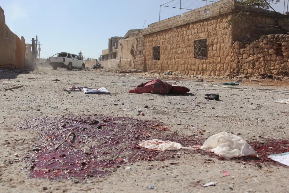 The aftermath of an airstrike in al-Hass, Syria, on October 26. Between seven and nine bombs, concentrated on the town’s school complex and roads leading to it, killed dozens of civilians including children.  